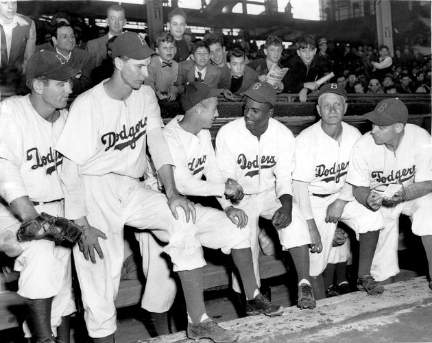 Per The New York Times: "The trailblazer Jackie Robinson in an Ebbets Field dugout in 1947 with members of the Brooklyn Dodgers." For some reason they left out Eddie (C) 2013 The New York Times